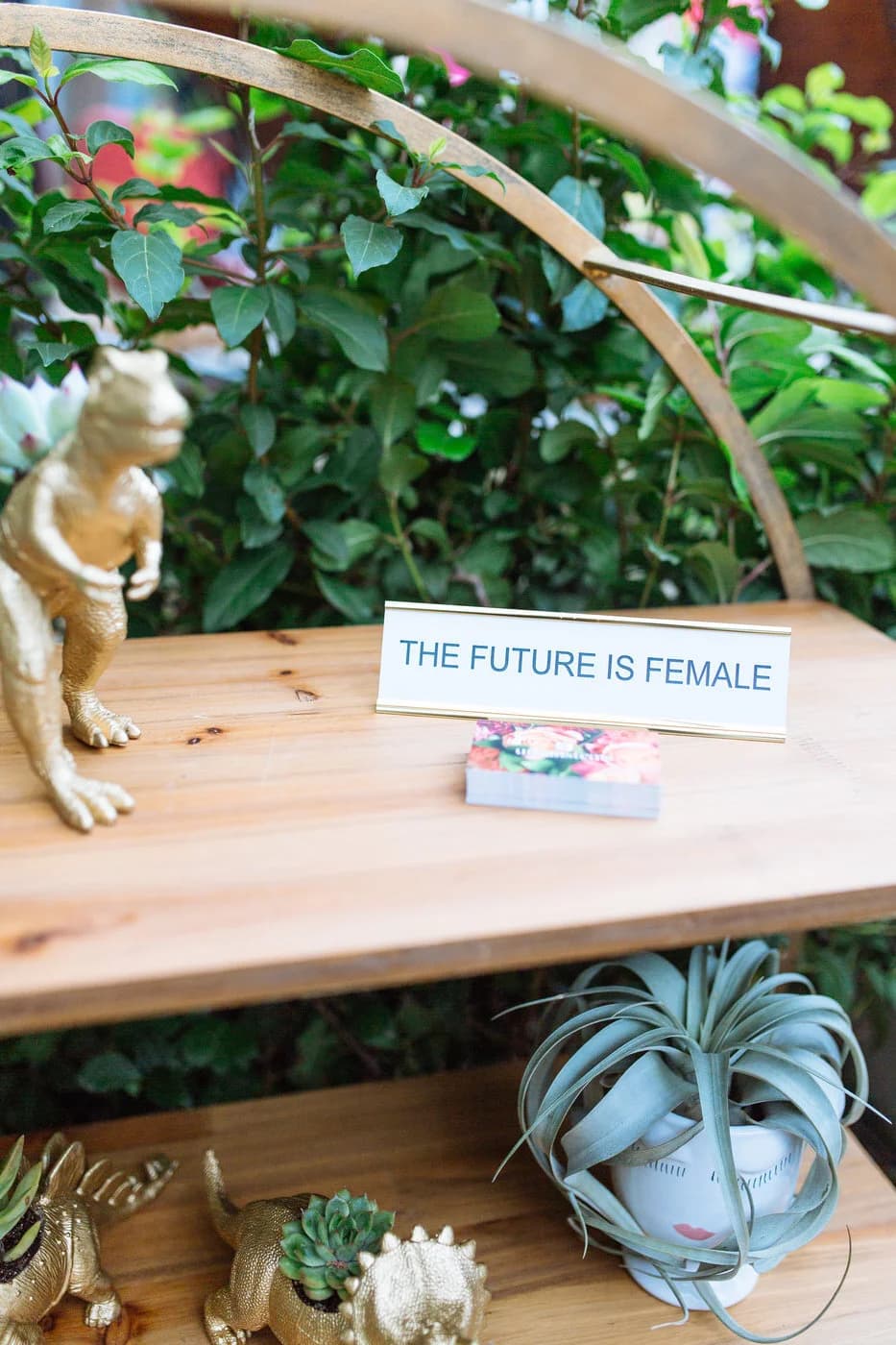 Braid bar — attendee engaging with the floral installation